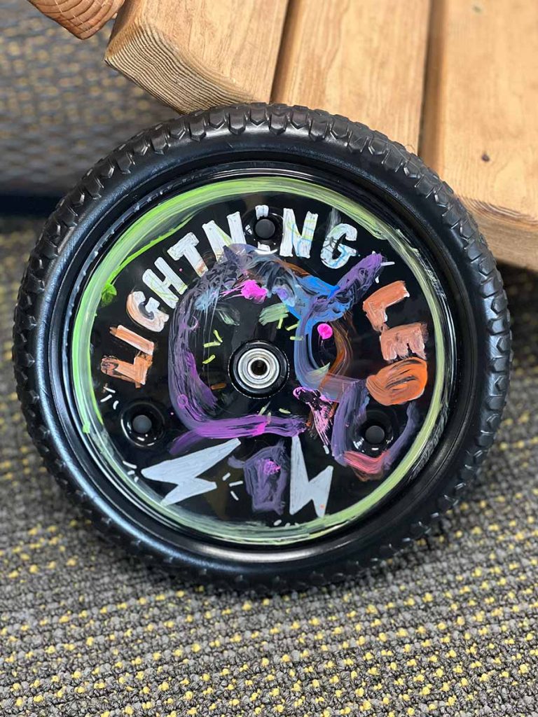 Strider Disc Wheel Cover decorated with paint markers